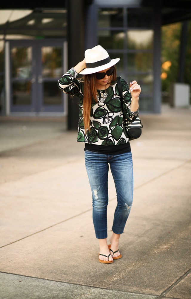 casual jeans and a green palm print shirt