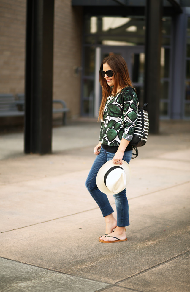 green floral print blouse and distressed jeans