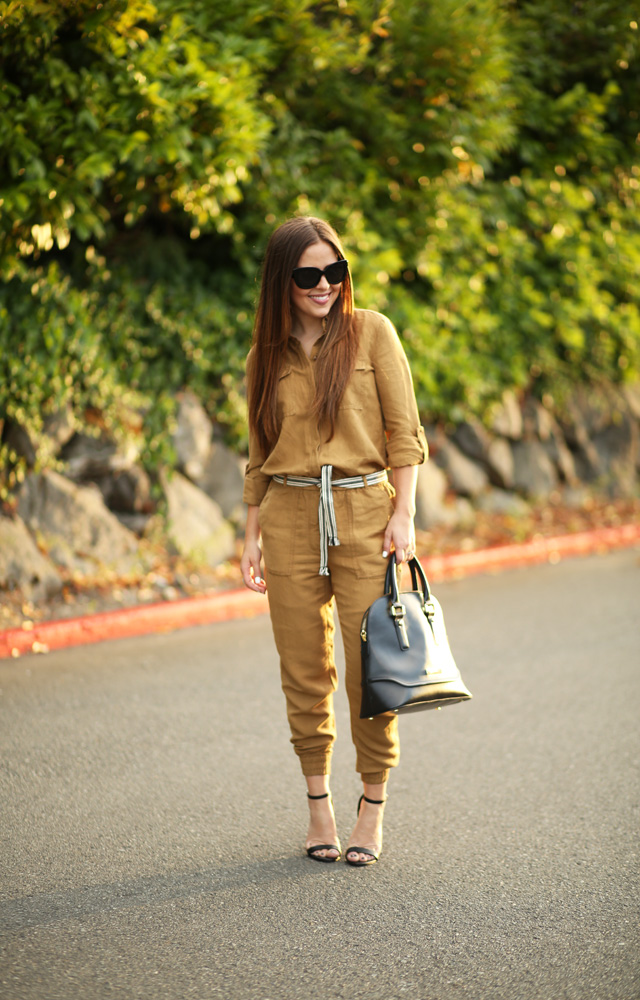 mustard belted jumpsuit with black bag