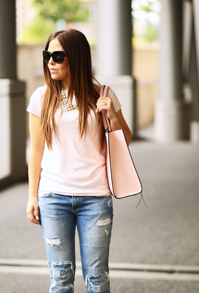 pink tee with distressed jeans