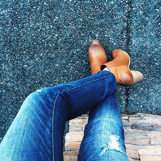cognac boots and ripped jeans