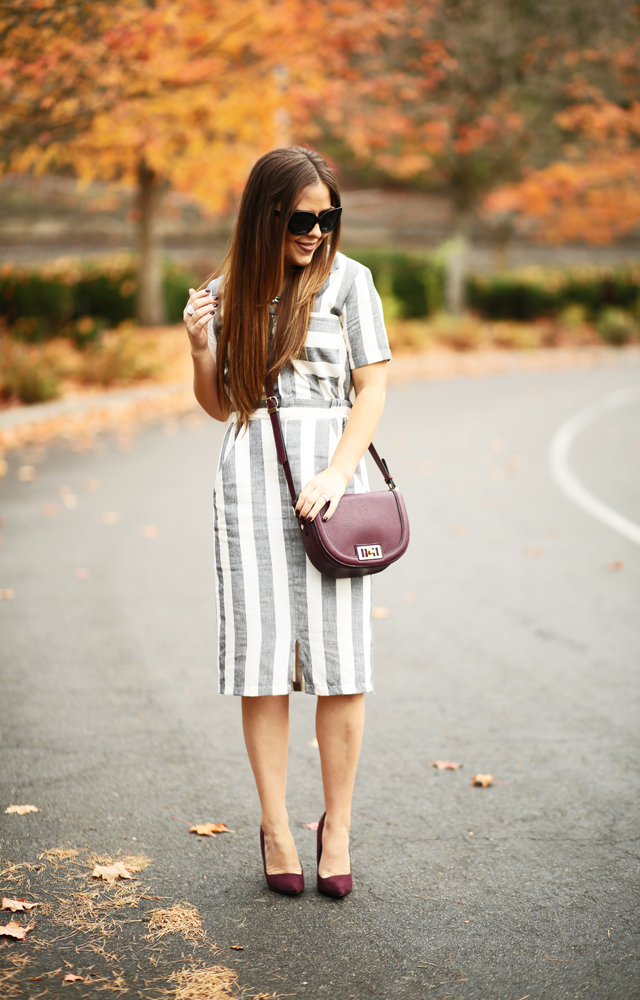 burgundy bag and shoes with black and white striped shirtdress