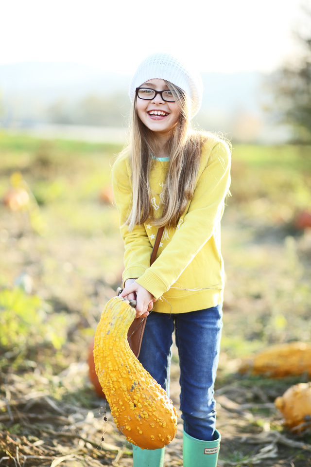 cute girl and a giant gourd