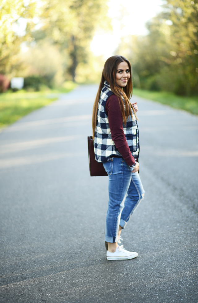 denim and a buffalo check vest layered look for fall