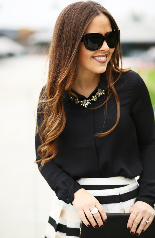 black drapey blouse pretty necklace