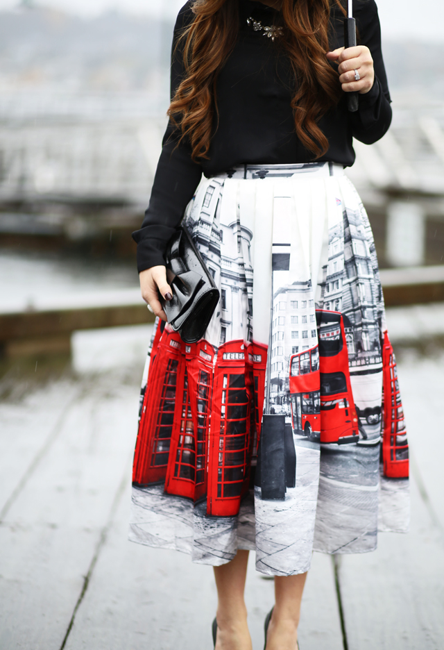 red and black london skirt in the rain