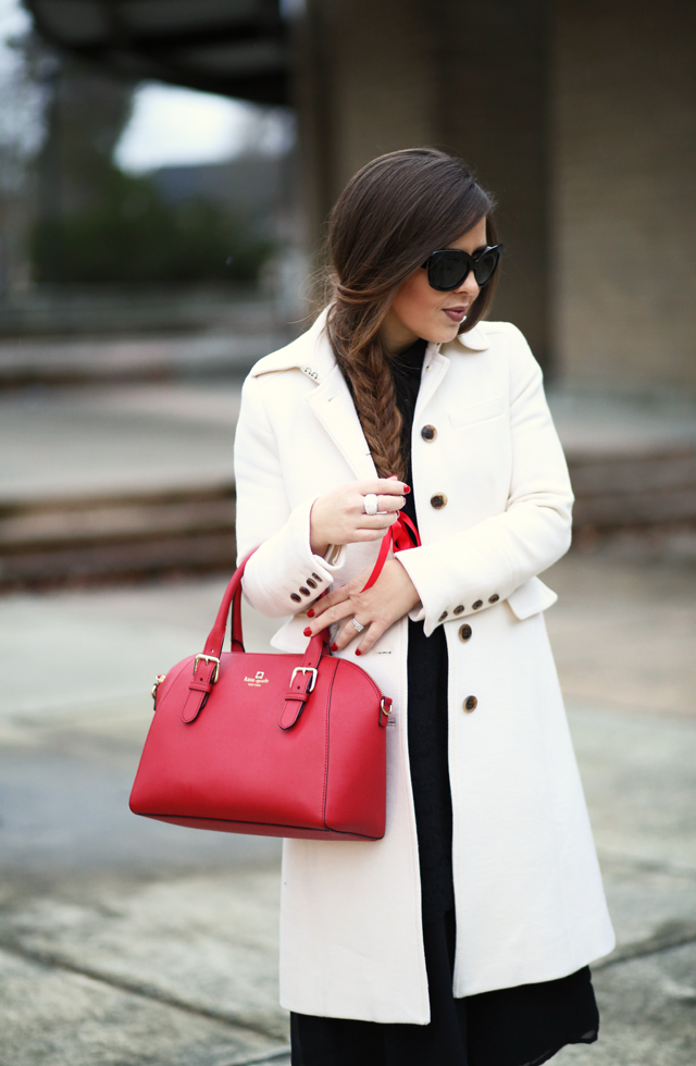 black dress white coat red bag