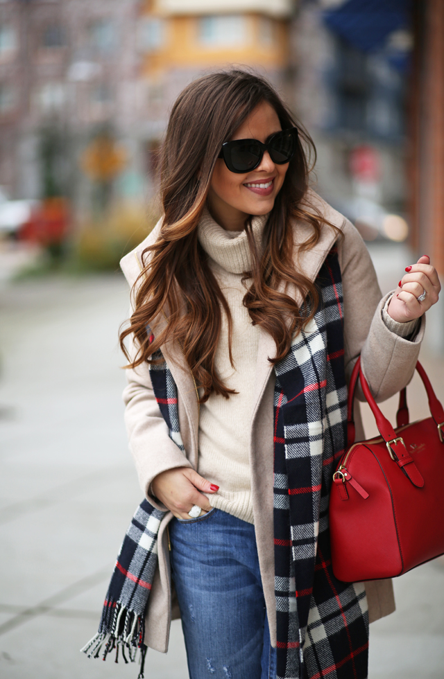 neutral coat and turtleneck with red bag