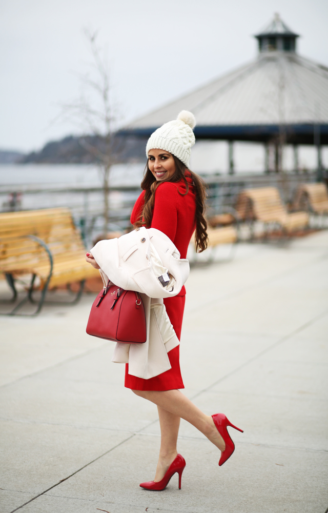 red on red with a white pom beanie white jcrew coat