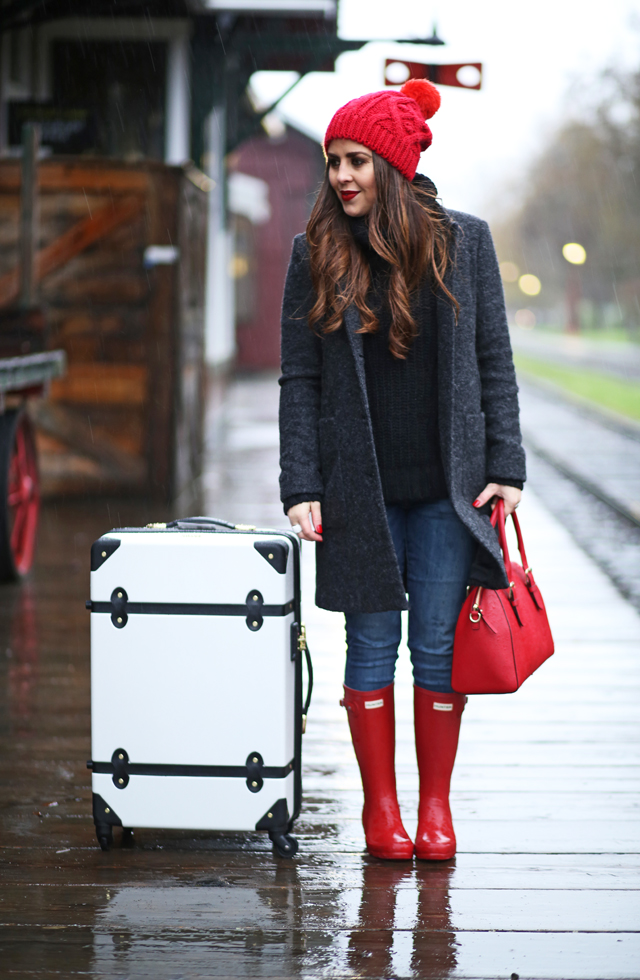 white suitcase with pops of red