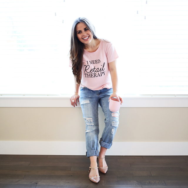 retail therapy pink tee and ripped jeans