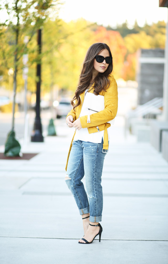mustard-moto-jacket-white-clutch-jeans
