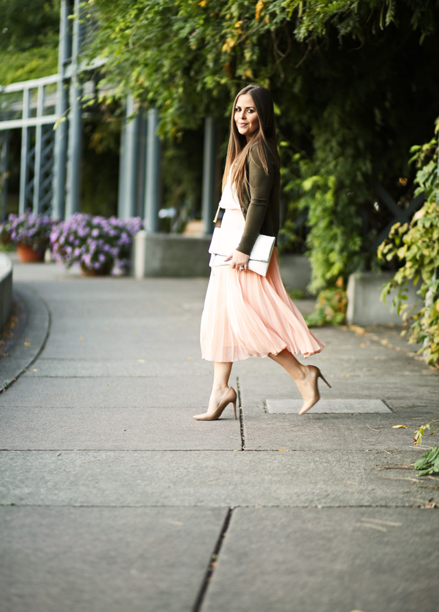 walking-in-a-pink-pleated-skirt